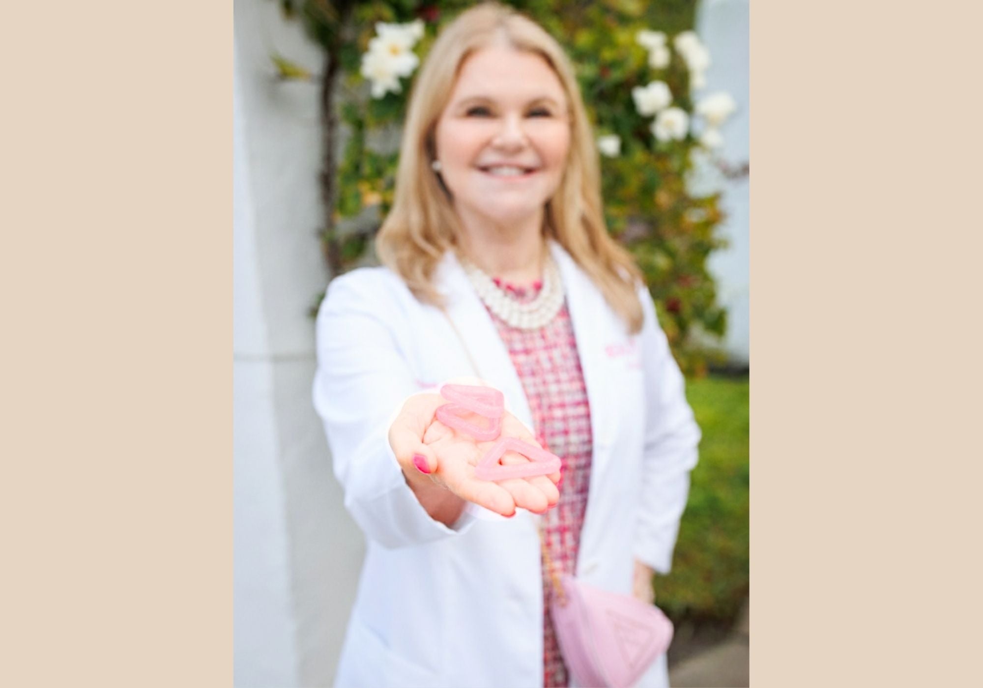 Dr. Katie holding the Triangle and Butterfly tools — representing doctor-designed facial and neck strengthening for lift, smoother contours, jaw relief, and better nightly breathing.